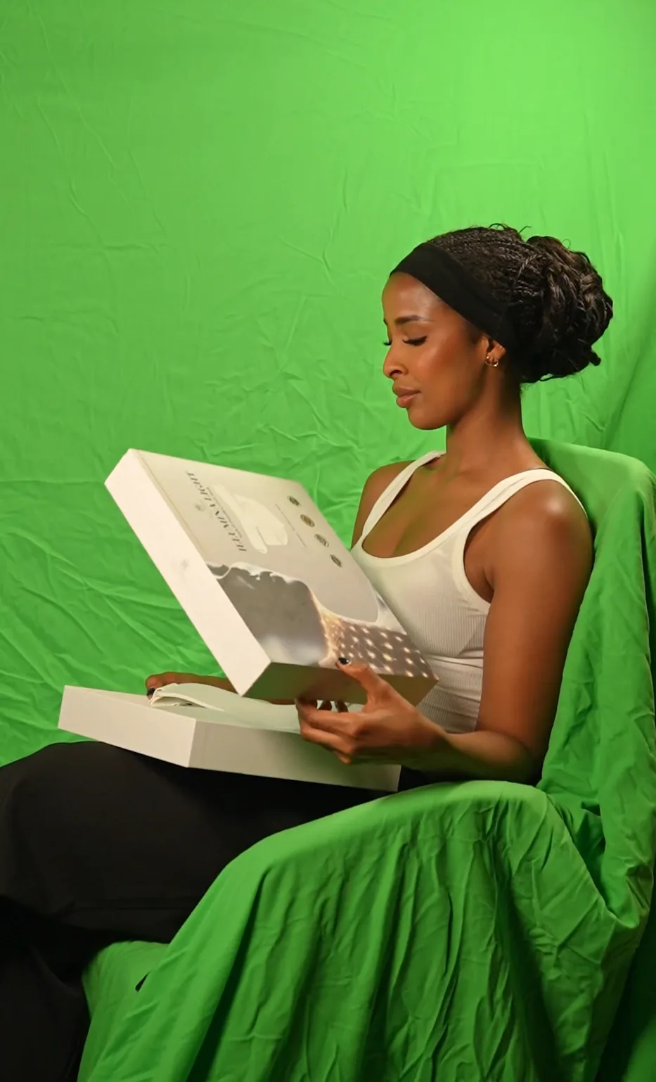 Talent holding a beauty product during an Edamame campaign shoot